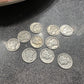 Mercury Silver Dime Coins on a concrete surface