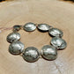 Mercury Silver Dime Coin Bracelet on a light wood round.