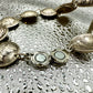 Mercury Silver Dime Coin Bracelet featuring magnetic clasp on a shiny texture metallic background.