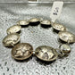 Mercury Silver Dime Coin Bracelet on a shiny texture metallic background.