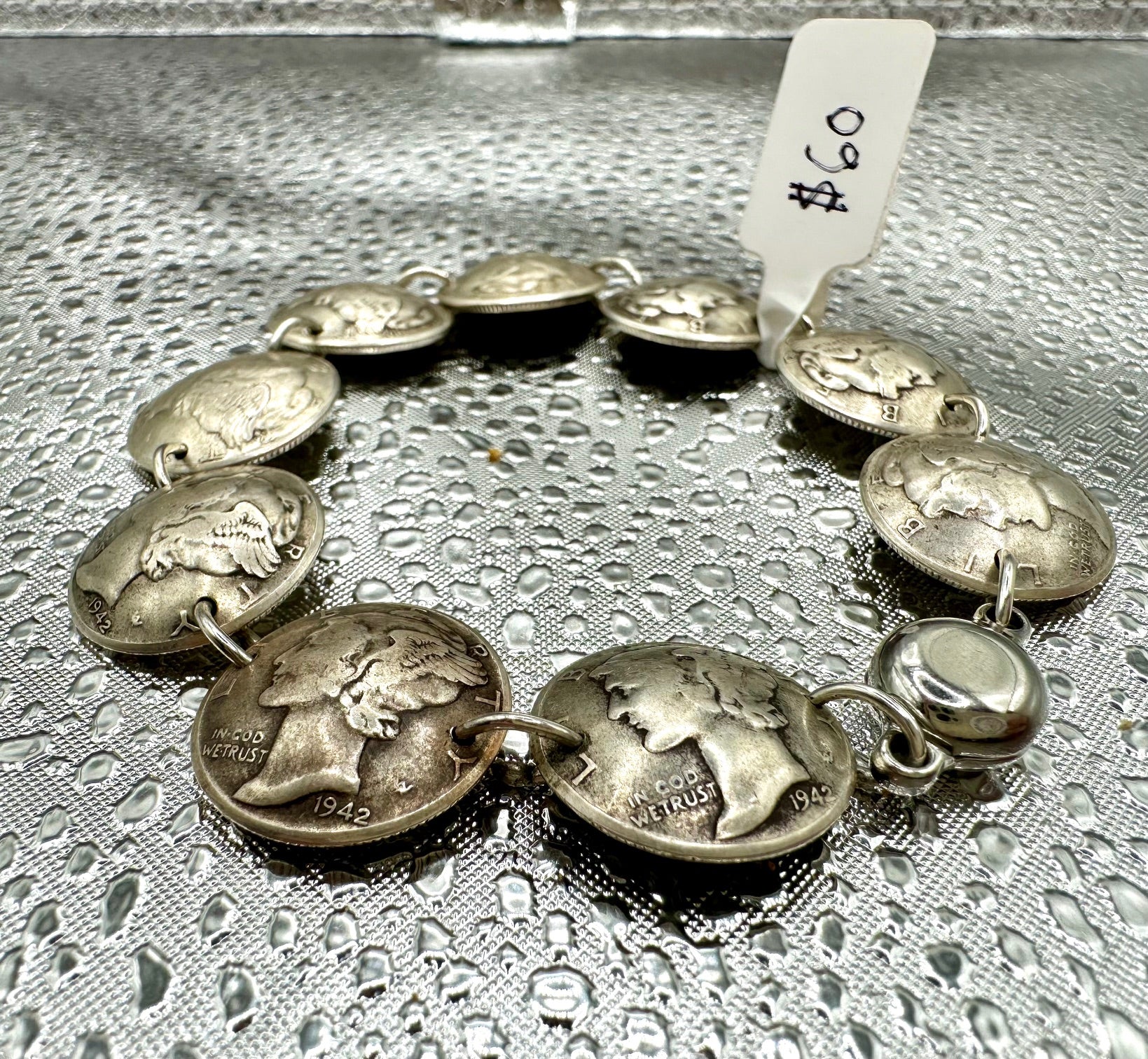 Mercury Silver Dime Coin Bracelet on a shiny texture metallic background.