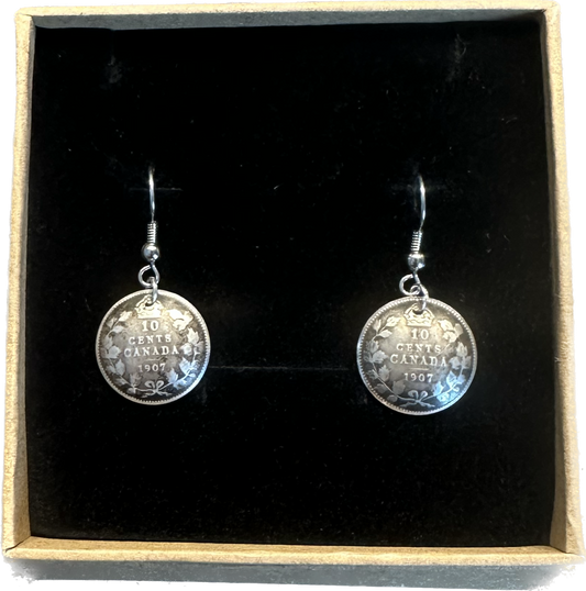 Canada 10 Cents Silver Domed Earrings in a brown kraft box on a black velvet background.