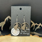 Idahome State Quarter Hand Cut Coin Earrings on a black earring backing.