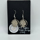 Native Nickel Cut Coin Earrings on black background with round Mountainstruck Coin Ring & Jewelry sticker in bottom left corner.