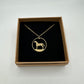 Horse Ireland 20 Pence Hand Cut Coin Necklace in a brown kraft box on a black velvet background.