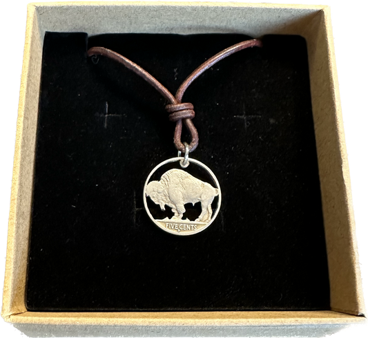 U.S. Buffalo Nickel (Reverse) Coin Necklace with a leather cord in a brown kraft box on a black velvet background.