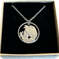 U.S. Walking Liberty Silver Hand Cut Coin Necklace (Eagle) with a stainless chain in a brown kraft box on a black velvet background.
