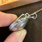 U.S. Silver Quarter Hand Crafted Coin Locket Necklace showing the opening mechanism.