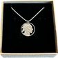 U.S. Buffalo Nickel (Front) Coin Necklace with a snake chain in brown kraft box on black velvet background.
