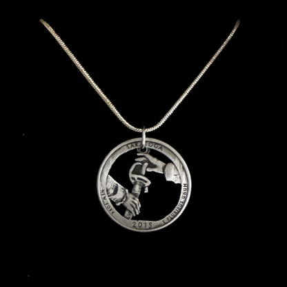U.S. Saratoga British Surrender Hand Cut Coin Necklace on black velvet background.
