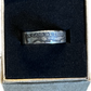 WW2 U.S. Silver Nickel Coin Ring in a brown kraft box on a black velvet background.