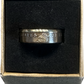 Presidential Gold Dollar Coin Ring in a brown craft box on a black velvet background.