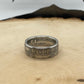 Newfoundland 50 Cents Silver Coin Ring on a light wood round.
