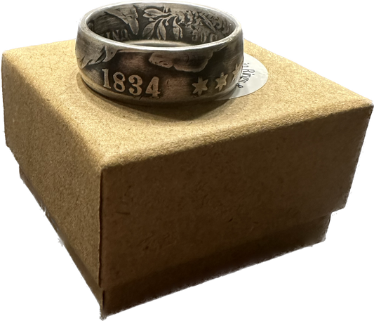 (Rare) Capped Bust Liberty Silver Half Dollar Coin Ring on brown kraft box.