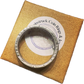 (Rare) Capped Bust Liberty Silver Half Dollar Coin Ring edge with inscription on brown kraft box.