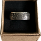 UK One Florin Silver Coin Ring in a brown kraft box on a black velvet background.
