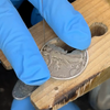 Video of Aidan Poe hand cutting out the background of a 1944 U.S. Walking Liberty Half Dollar to make into a necklace. - Mountainstruck Coin Jewelry