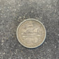 U.S. 1892-1893 Chicago Columbus Silver Half Dollar Coin back on a concrete background.