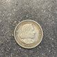 U.S. 1892-1893 Chicago Columbus Silver Half Dollar Coin front on a concrete background.