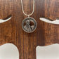 U.S. First American Woman in Space Coin Necklace with a snake chain on a wood tree background. - Mountainstruck Coin Jewelry
