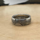 U.S. 1892-1893 Chicago Columbus Silver Half Dollar Coin Ring (patina) on a light wood round.