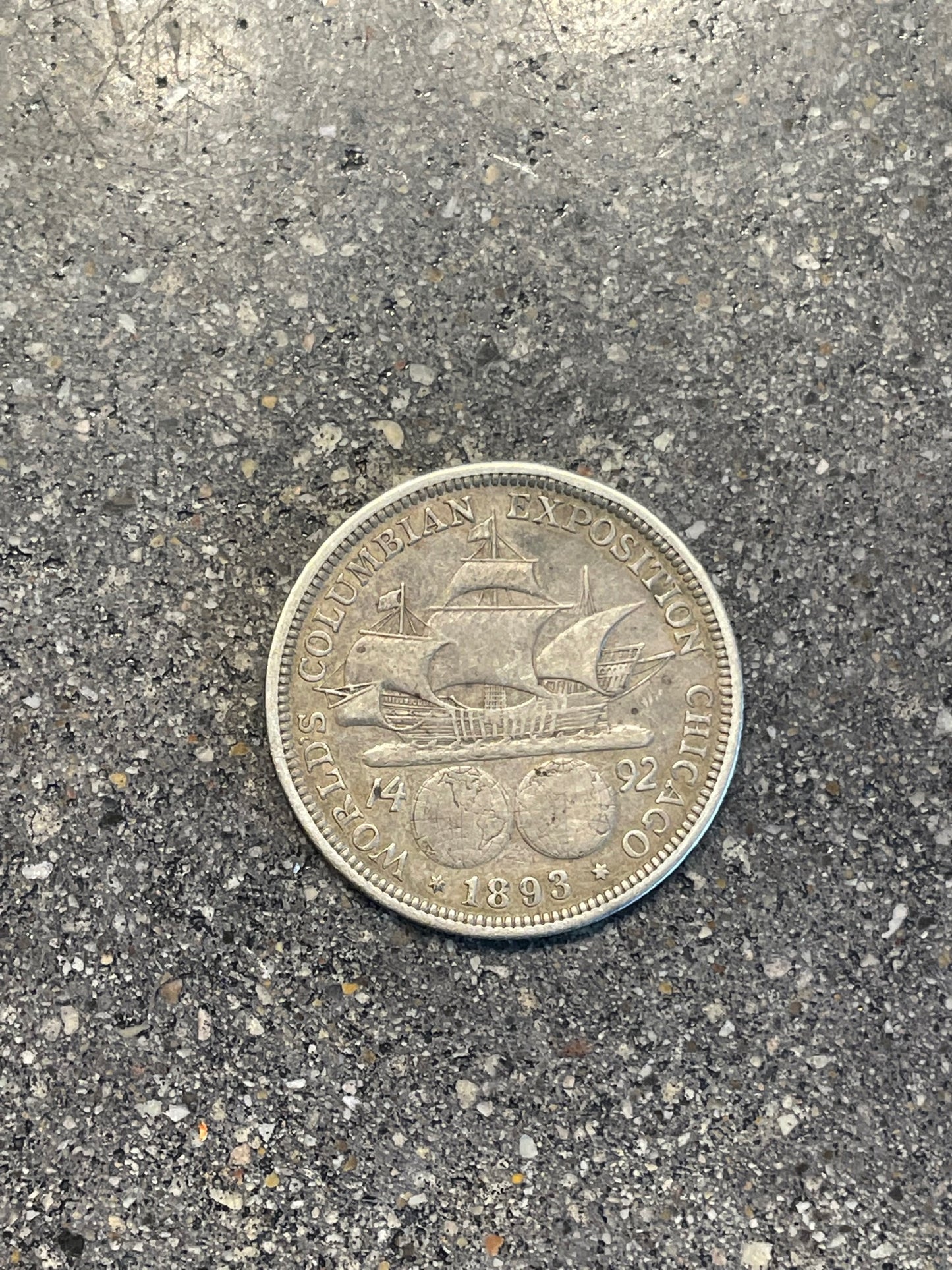 U.S. 1892-1893 Chicago Columbus Half Dollar Silver Coin back on a concrete background. - Mountainstruck Coin Jewelry