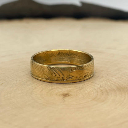 U.S. Gold Eagle 1/4 oz Fine Gold Coin Ring on a light wood round. - Mountainstruck Coin Jewelry