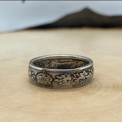 Canada 25 Cents Maple Leaf Silver Coin Ring on a light wood round. - Mountainstruck Coin Jewelry