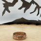 Canada Large Cent Leaf Coin Ring on a light wood round with a mountain outline background. - Mountainstruck Coin Jewelry