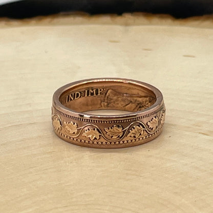 Canada Large Cent Leaf Coin Ring on a light wood round with a mountain outline background. - Mountainstruck Coin Jewelry