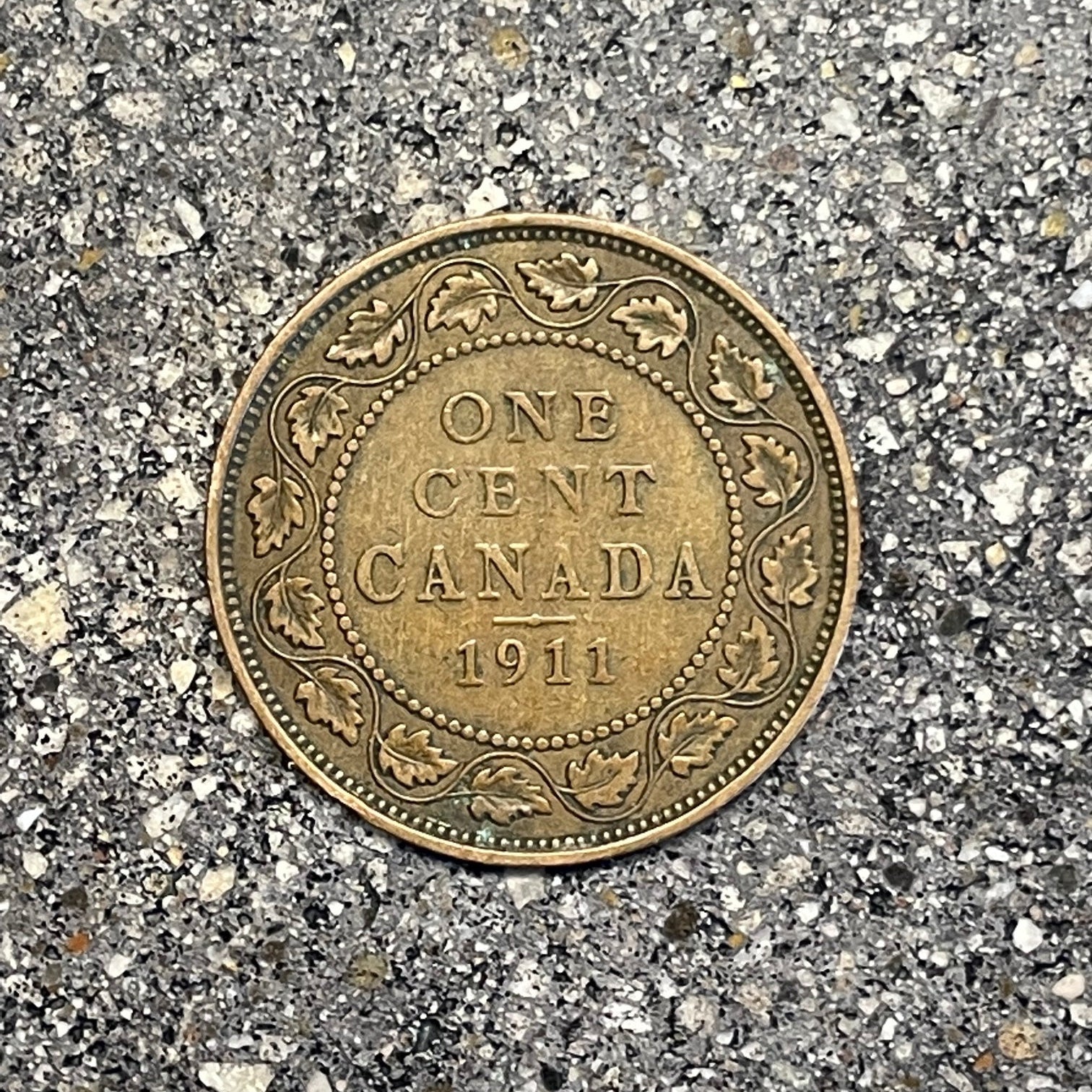 Canada Large Cent Leaf coin (back) on a concrete background. - Mountainstruck Coin Jewelry