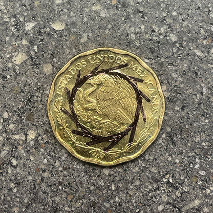 Mexico 50 Centavos Coin front on a concrete background. - Mountainstruck Coin Jewelry