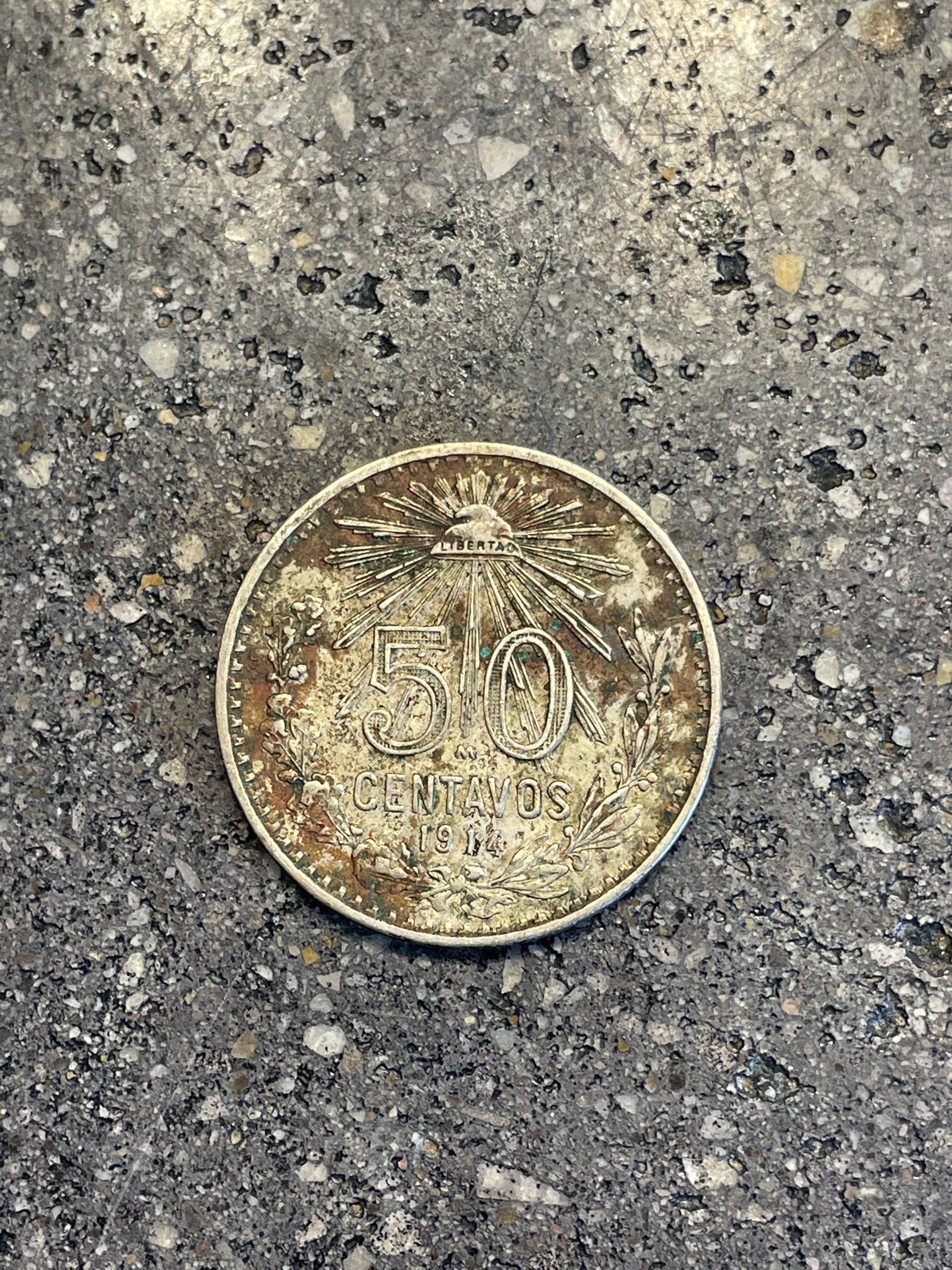 Mexico 50 Centavos Silver (Rare) Coin back on a concrete background. - Mountainstruck Coin Jewelry