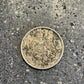 Mexico 50 Centavos Silver (Rare) Coin front on a concrete background. - Mountainstruck Coin Jewelry