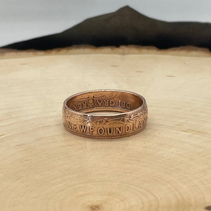 Newfoundland 1 Cent Coin Ring on a light wood round. - Mountainstruck Coin Jewelry