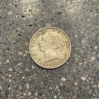 Newfoundland 20 Cents Silver Coin front on a concrete background. - Mountainstruck Coin Jewelry