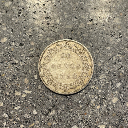 Newfoundland 20 Cents Silver Coin back on a concrete background. - Mountainstruck Coin Jewelry