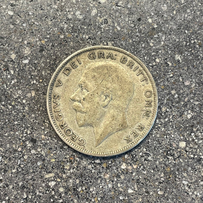 UK Half Crown Silver Coin front on a concrete background. - Mountainstruck Coin Jewelry