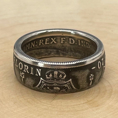 UK One Florin Silver Coin Ring on a light wood round.  - Mountainstruck Coin Jewelry