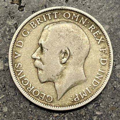 UK One Florin Silver Coin front on a concrete background. - Mountainstruck Coin Jewelry