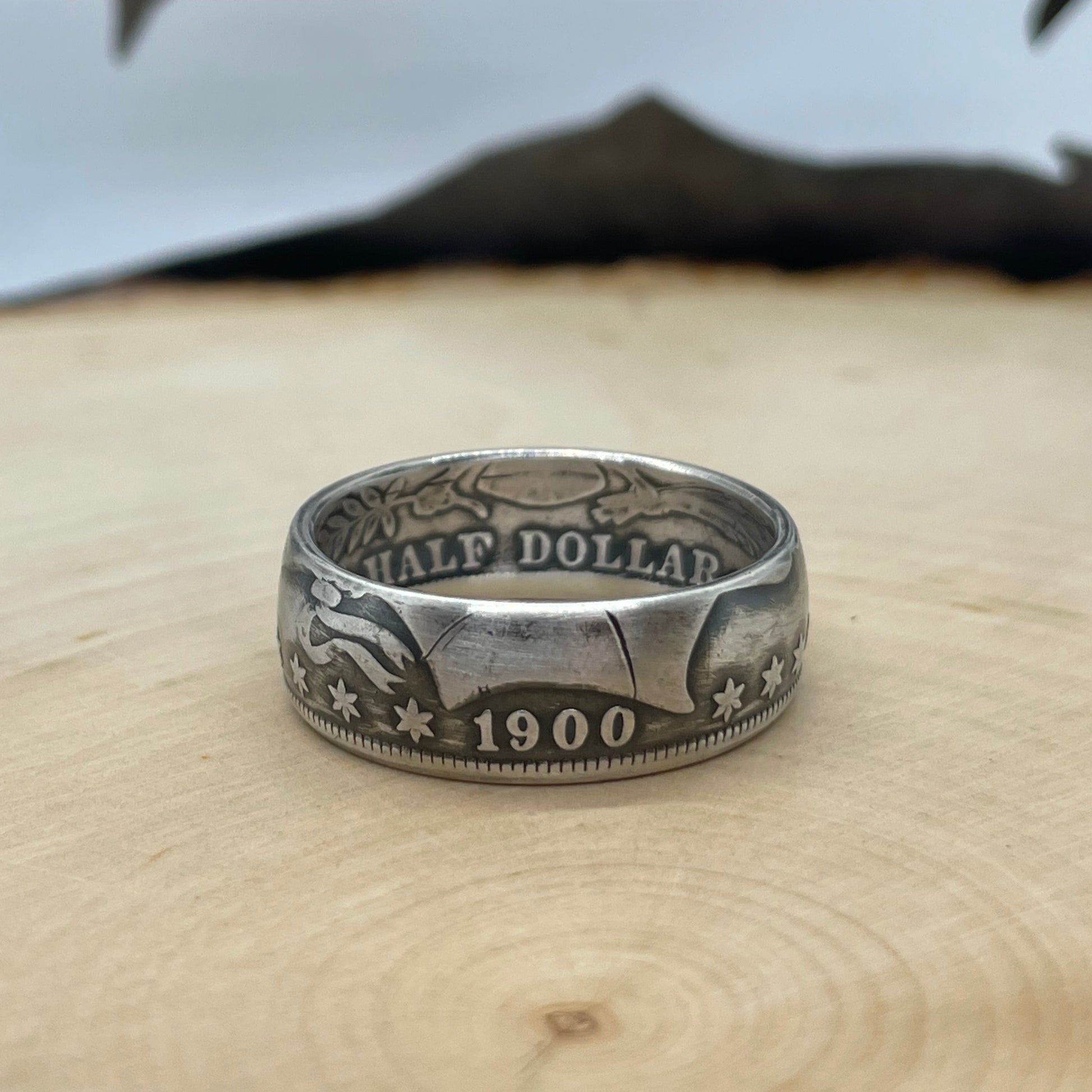 Barber Silver Half Dollar Coin Ring (front) on a light wood background. - Mountainstruck Coin Jewelry