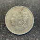 Morgan Dollar Silver Coin front on a concrete background. - Mountainstruck Coin Jewelry
