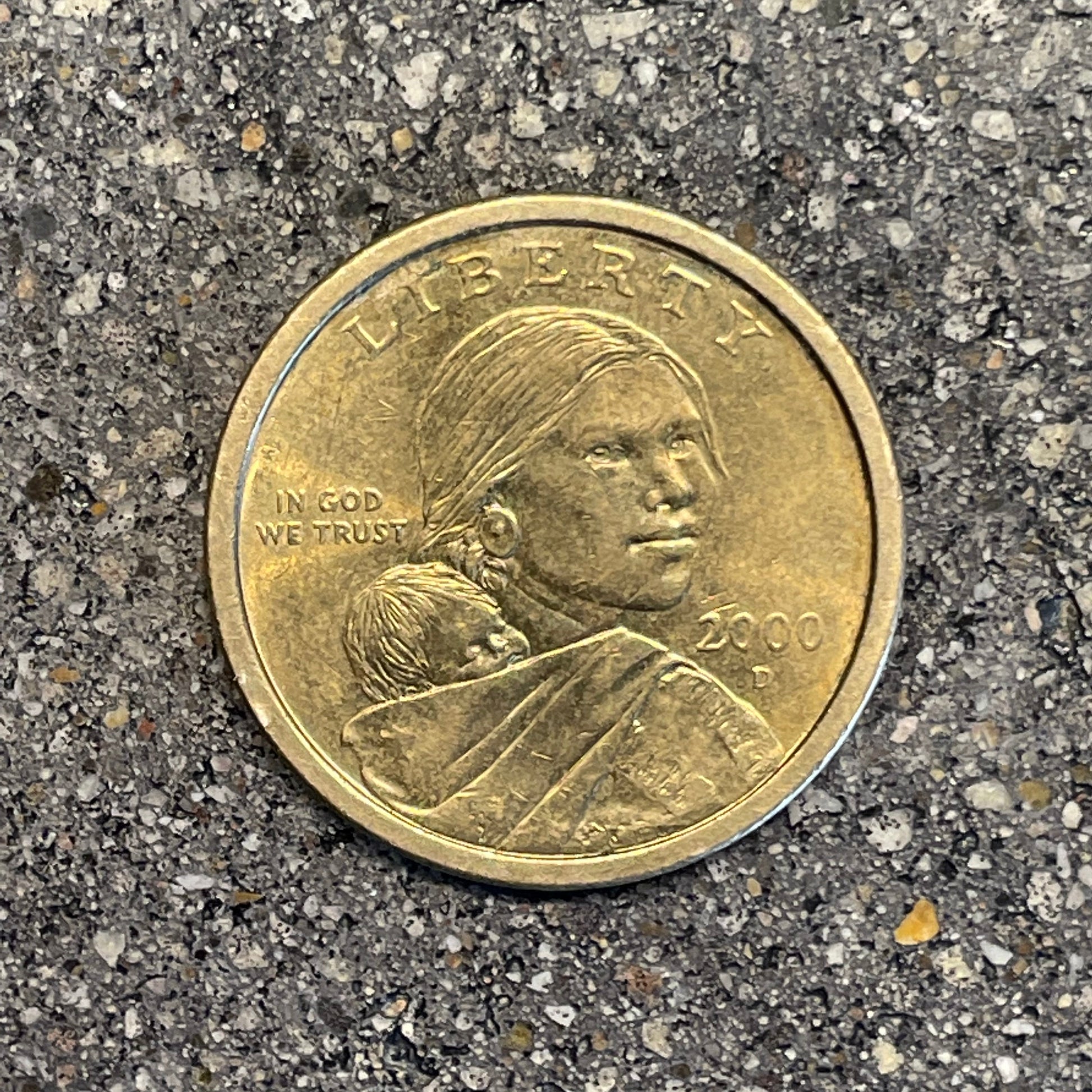 Sacagawea Dollar Coin front on a concrete background. - Mountainstruck Coin Jewelry