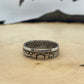 Seated Liberty Silver Quarter Coin Ring on a light wood round with mountain outline in the background. - Mountainstruck Coin Jewelry
