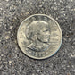 U.S. Susan B. Anthony Dollar Coin front on a concrete background. - Mountainstruck Coin Jewelry