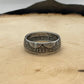 U.S. 1892-1893 Chicago Columbus Silver Half Dollar Coin Ring (patina) on a light wood round. - Mountainstruck Coin Jewelry