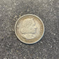 U.S. 1892-1893 Chicago Columbus Silver Half Dollar Coin front on a concrete background.  - Mountainstruck Coin Jewelry