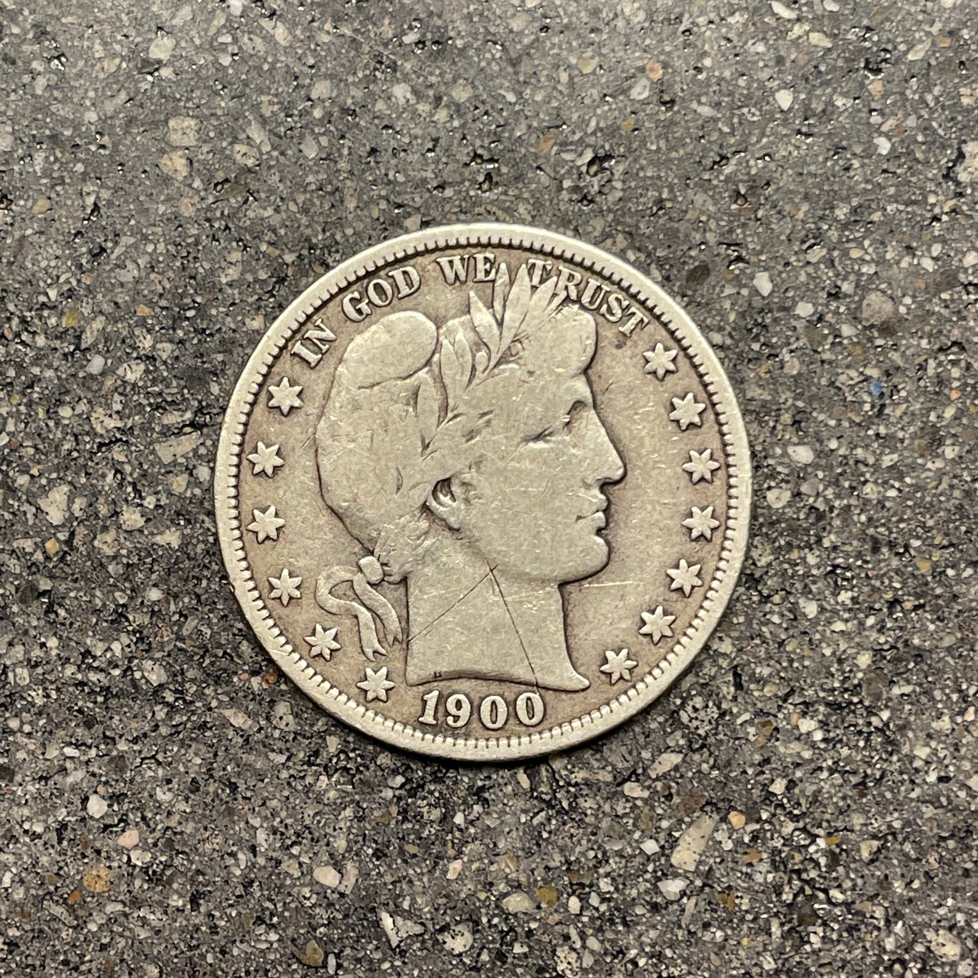 U.S. Barber Silver Half Dollar front of coin on a concrete background. - Mountainstruck Coin Jewelry