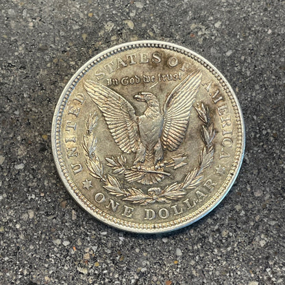 U.S. Morgan Dollar Silver Coin back on a concrete background. - Mountainstruck Coin Jewelry