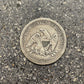 U.S. Seated Liberty Quarter Silver Coin back on a concrete background. - Mountainstruck Coin Jewelry